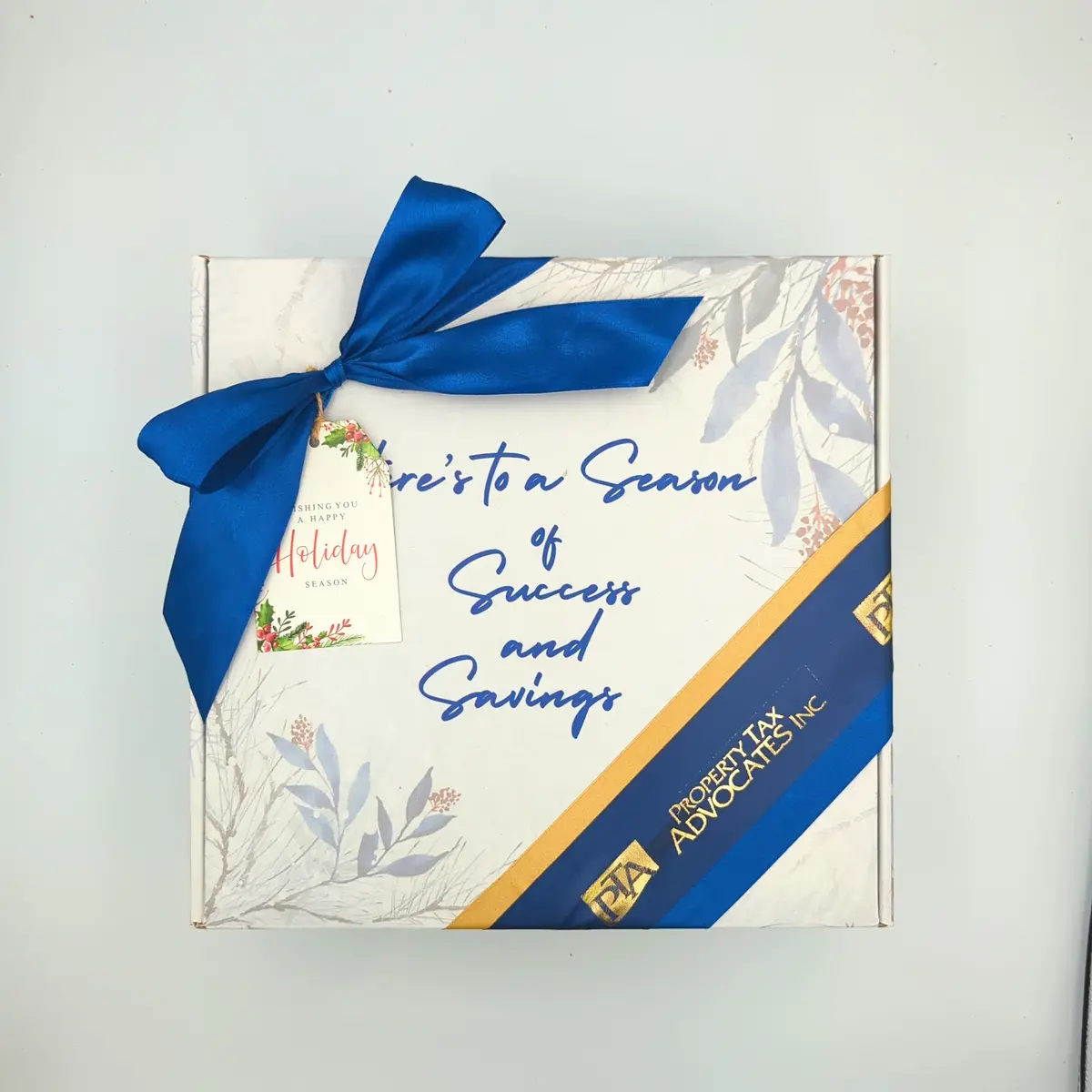 Property Tax Advocates holiday gift box with branded ribbon